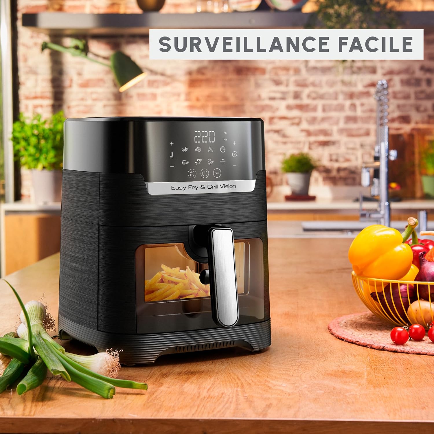 Friggitrice ad aria Moulinex Easy Fry & Grill Vision con cibo visibile attraverso viewfinestra