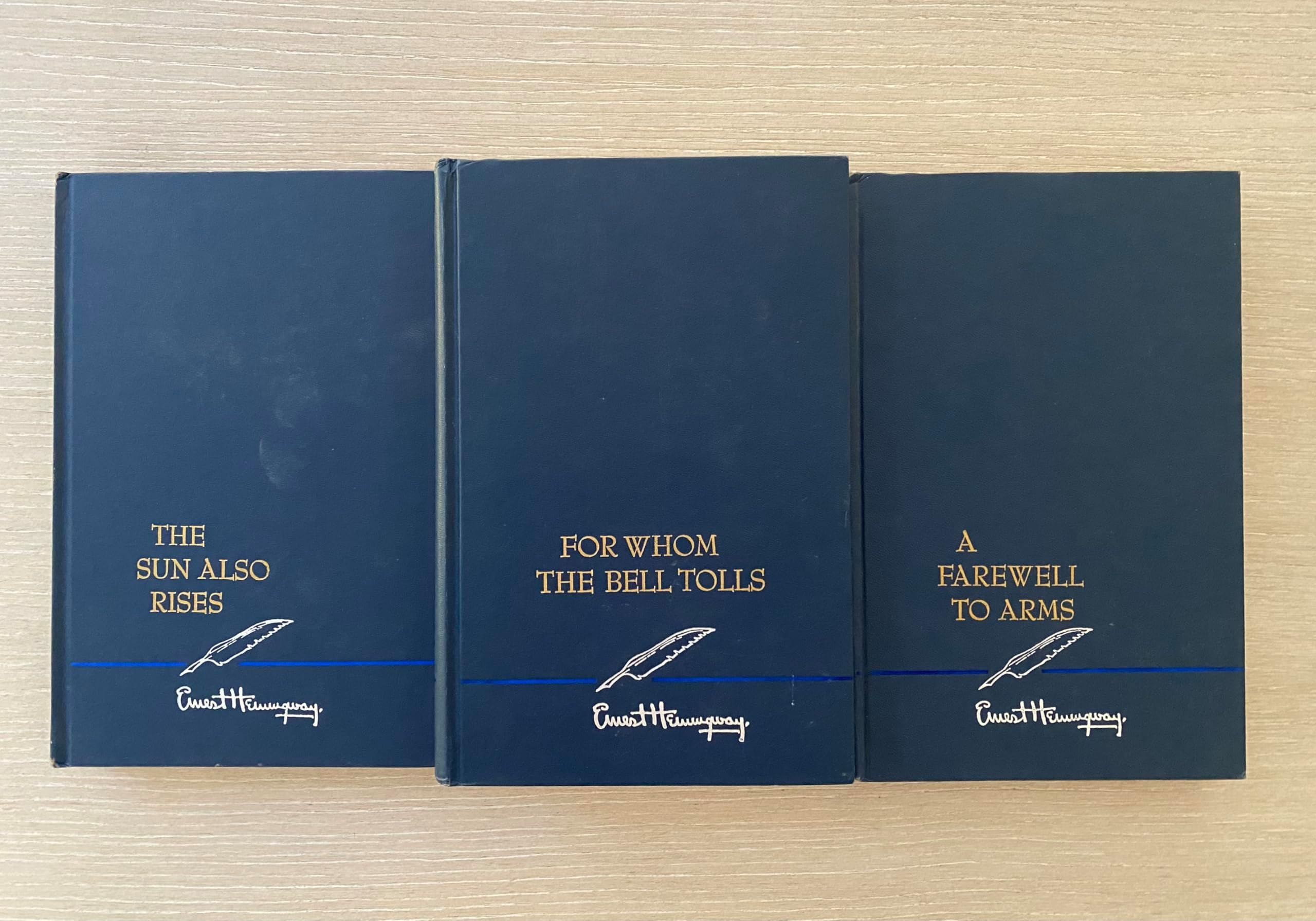 Set of Three Ernest Hemingway Novels. For Whom the Bell Tools 1968, a Farewell to Arms 1957, and the Sun Also Rises 1954