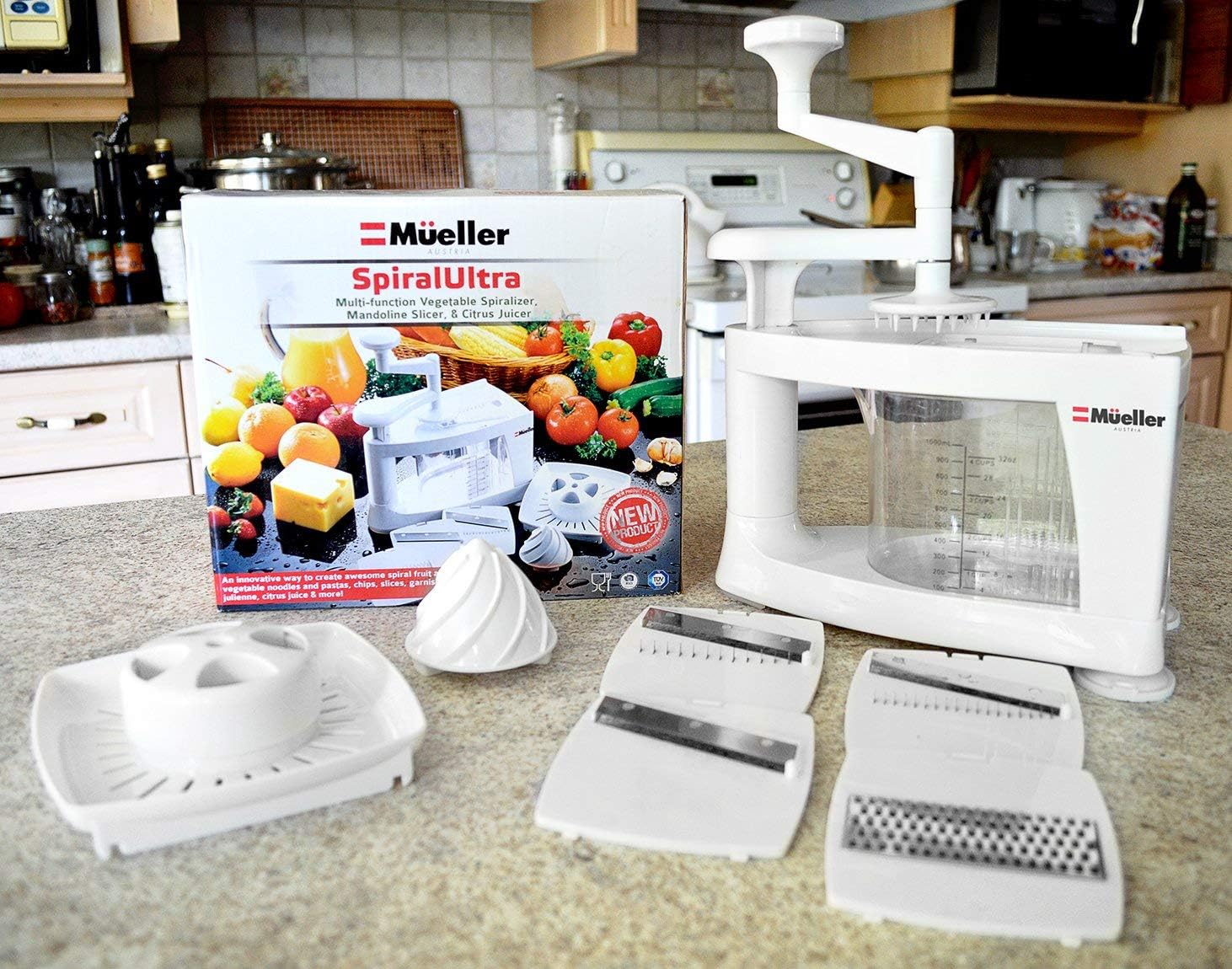 Mueller Spiral-Ultra Spiralizer components laid out next to its packaging