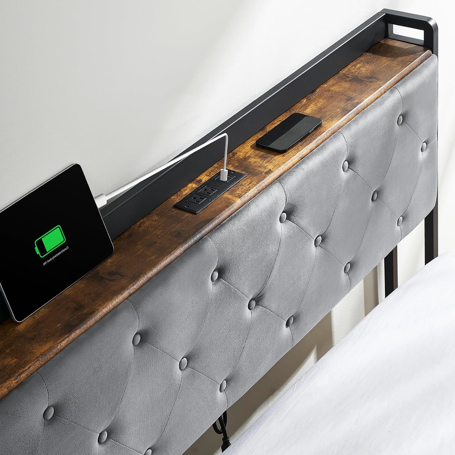 Close-up of the headboard charging station with AC outlets and USB ports