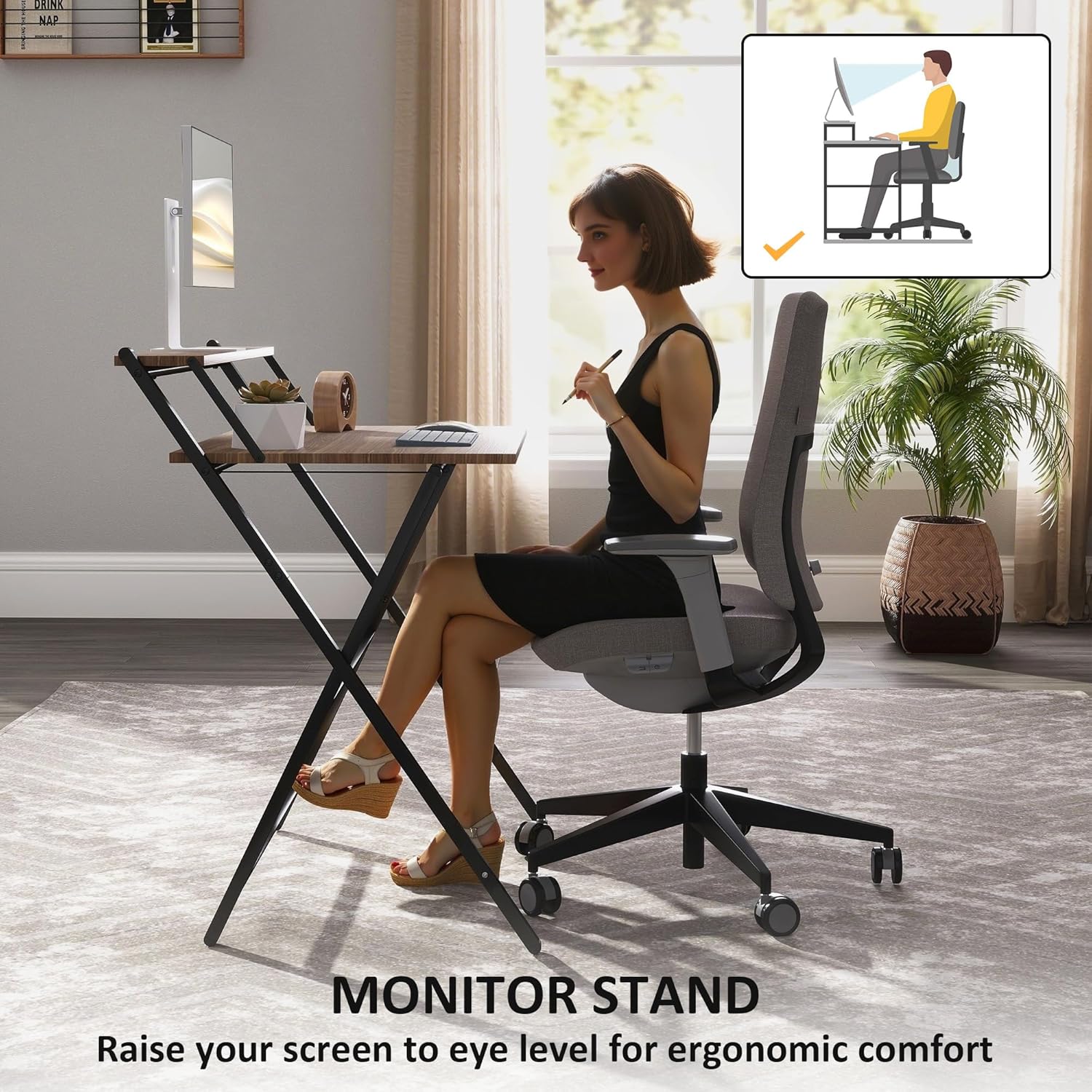 Woman sitting at the HOMCOM folding desk with a monitor on the top shelf, illustrating ergonomic posture