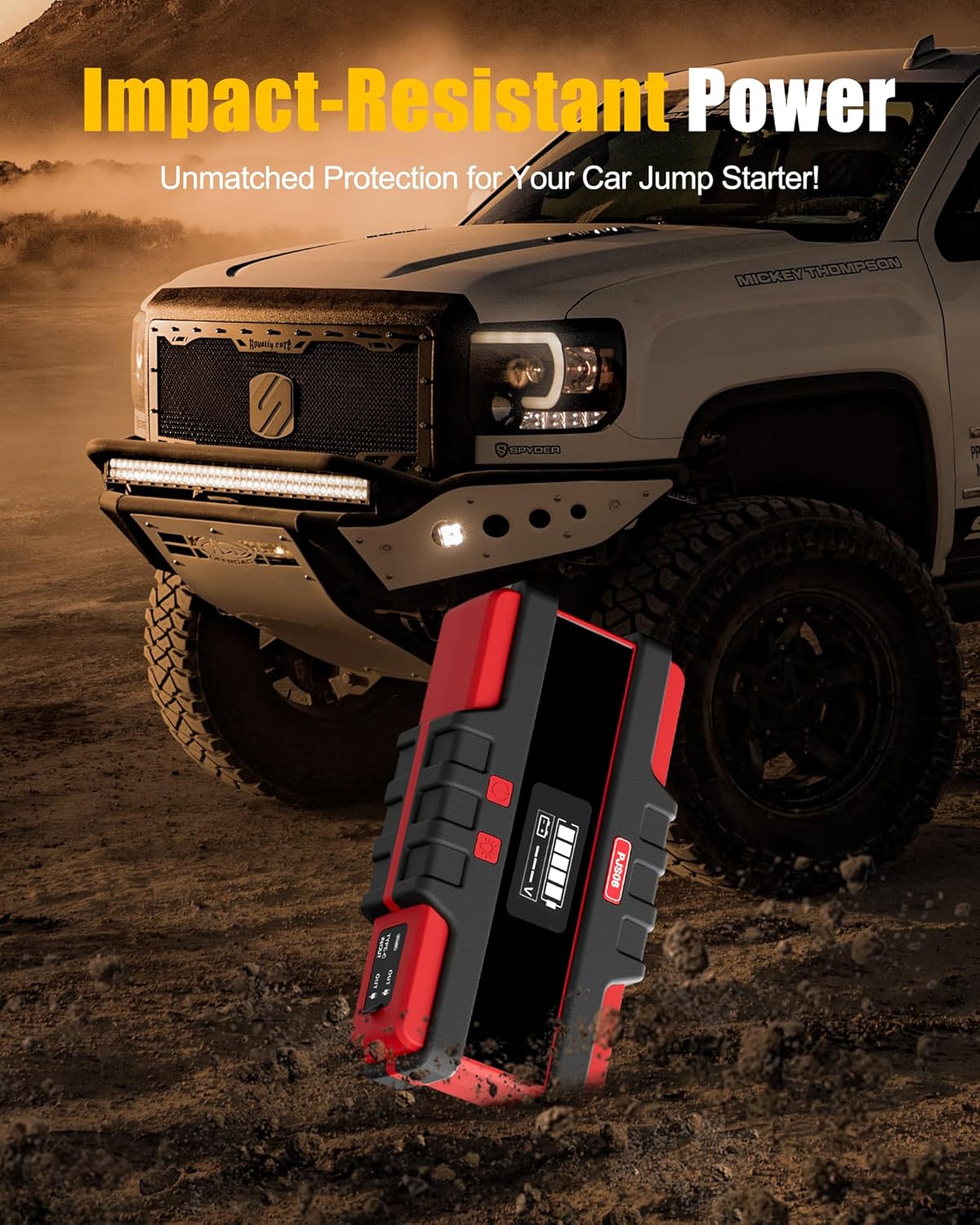 Image showing the SAFEMATE PJS06-2500 jump starter in a rugged outdoor environment, emphasizing its impact-resistant design.