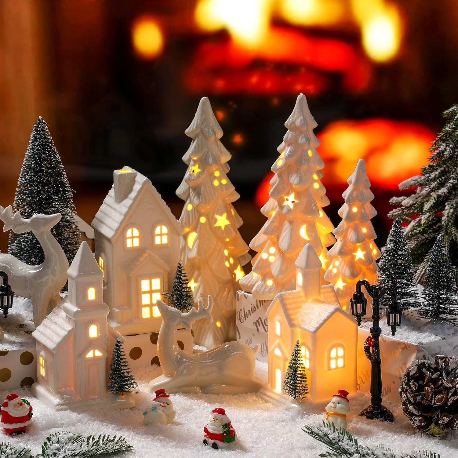 Nuogo 14 Pcs Ceramic White LED Christmas Village Houses Set Including Christmas Tree Porcelain Reindeer Figurine Small House Lamp Post Ceramic White Winter Village Decors for Xmas Tabletop Fireplace