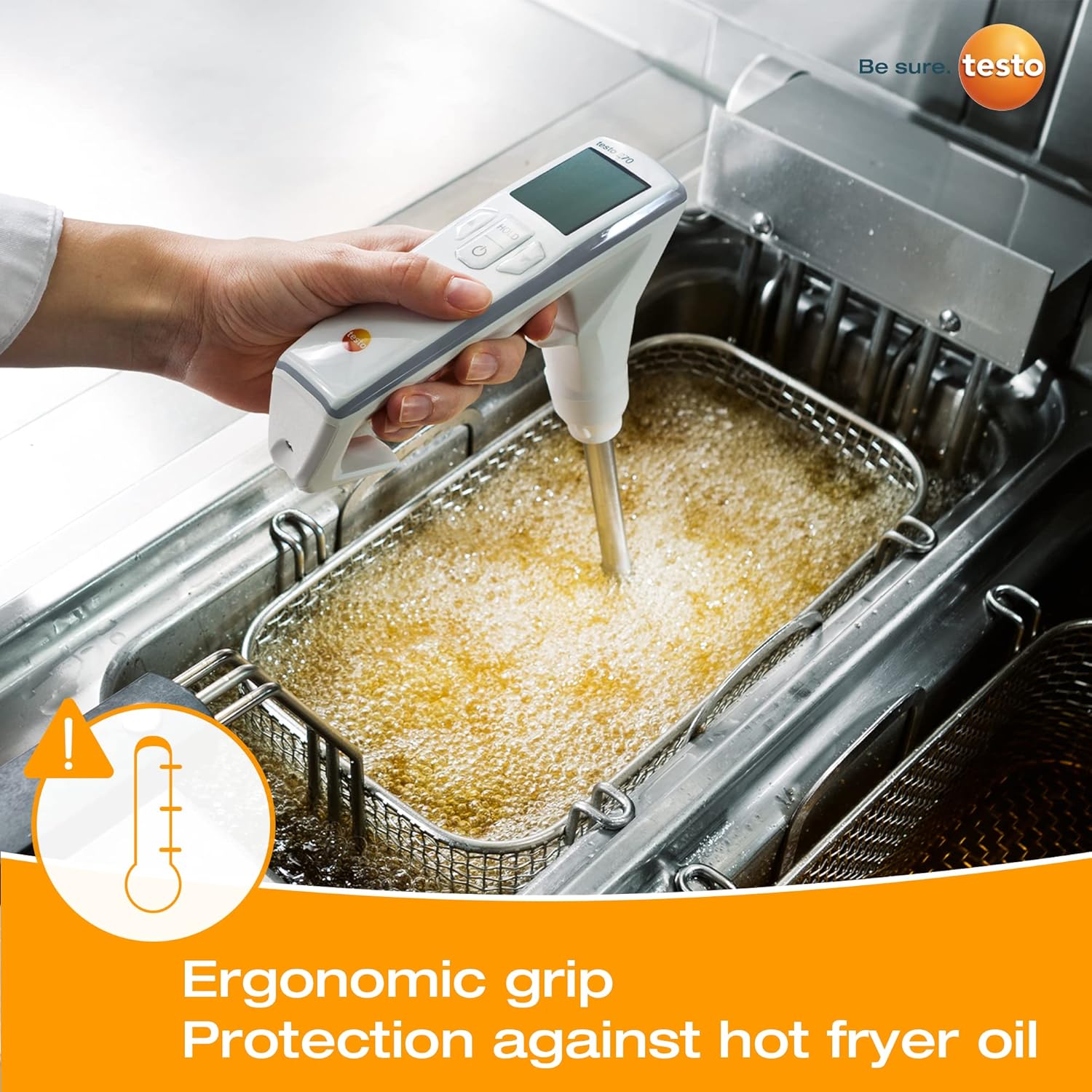Testo 270 Cooking Oil Tester being used to measure hot oil in a deep fryer, demonstrating the ergonomic grip.