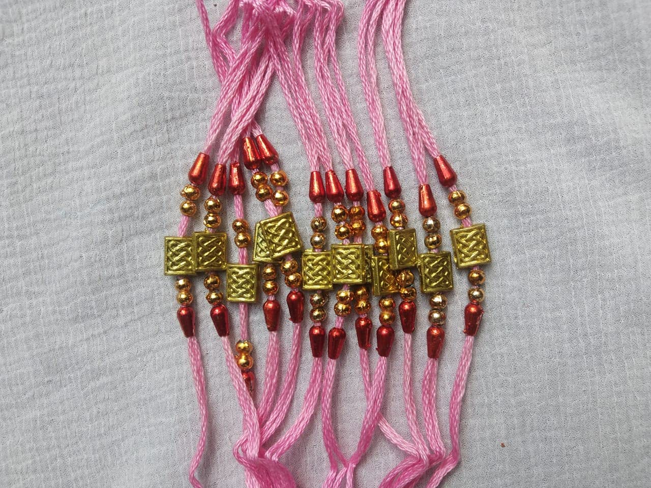 01 Super Shop Rakhi Pearls with roli & cawal Combo Pack for Man & Brothers Soft Silk Thread (Pack of 12)