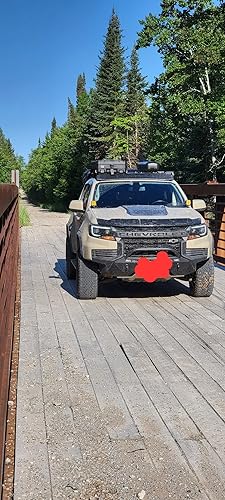 Review Image by Looks cool, can't see a thing at night the light has a hard cut off point about 40 feet in front of the truck.