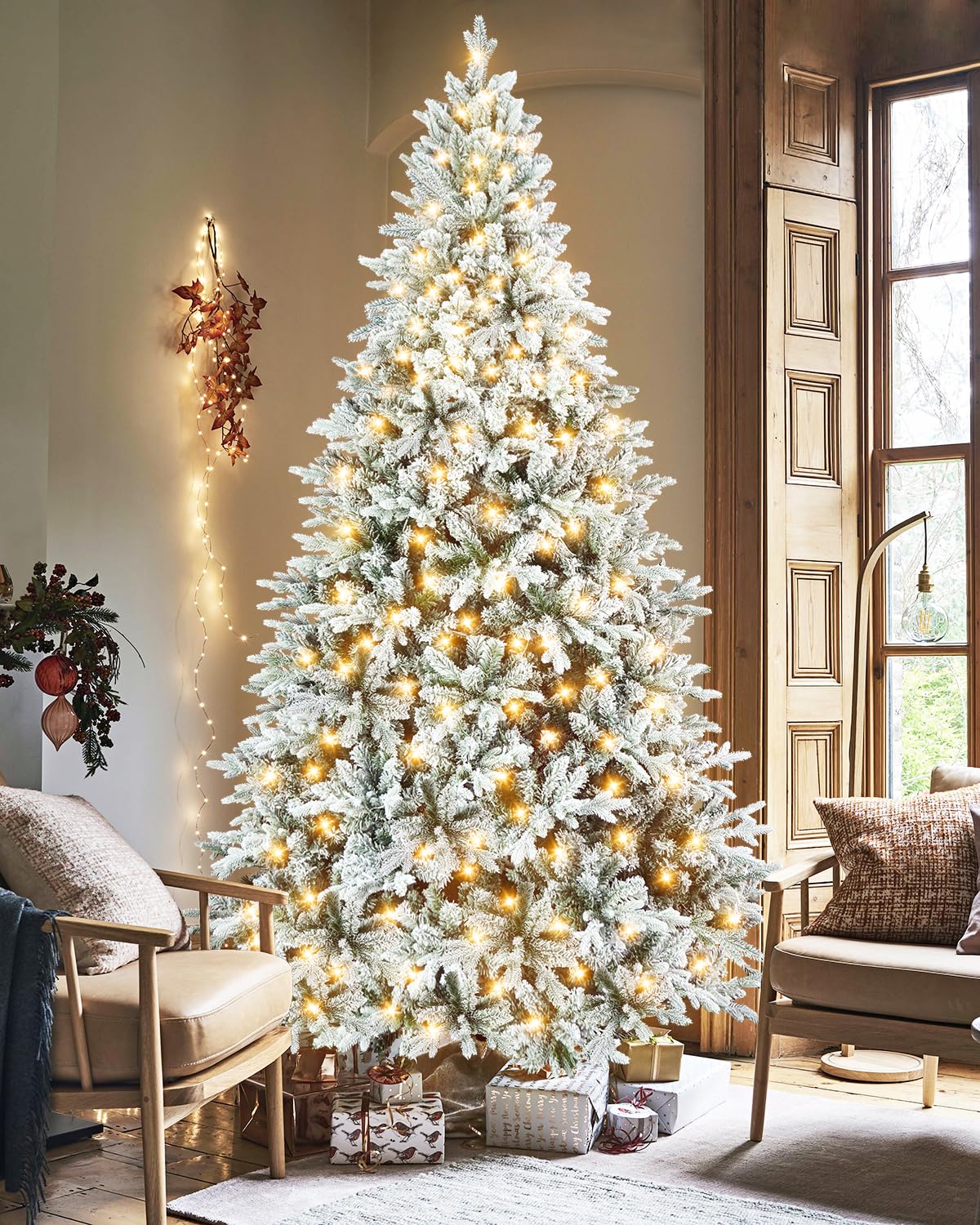 Uieke 9.5ft Lighted Artificial Christmas Tree, Premium PVC Snow Flocked Hinged Pine Tree, Full Appearance Snowy w/Easy Assembly Metal Stand, 1800 Tips and 450 LED Lights for Indoor, Outdoor, Home
