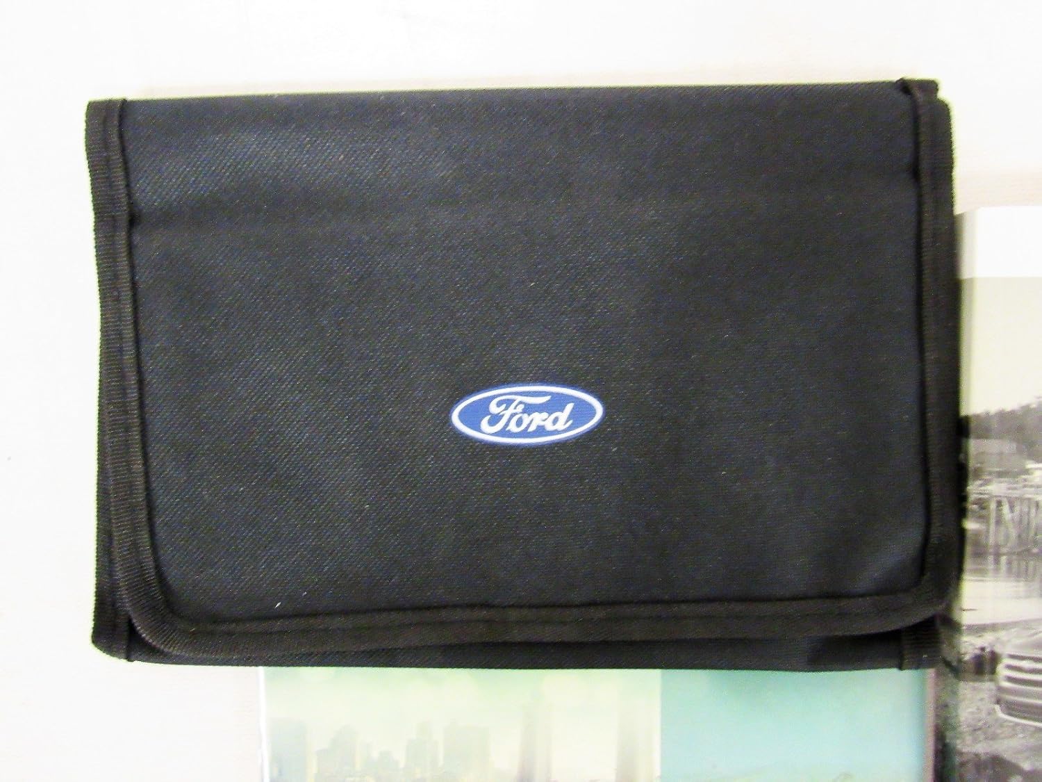 Black canvas case with Ford logo, containing the owner's manual and quick reference guide