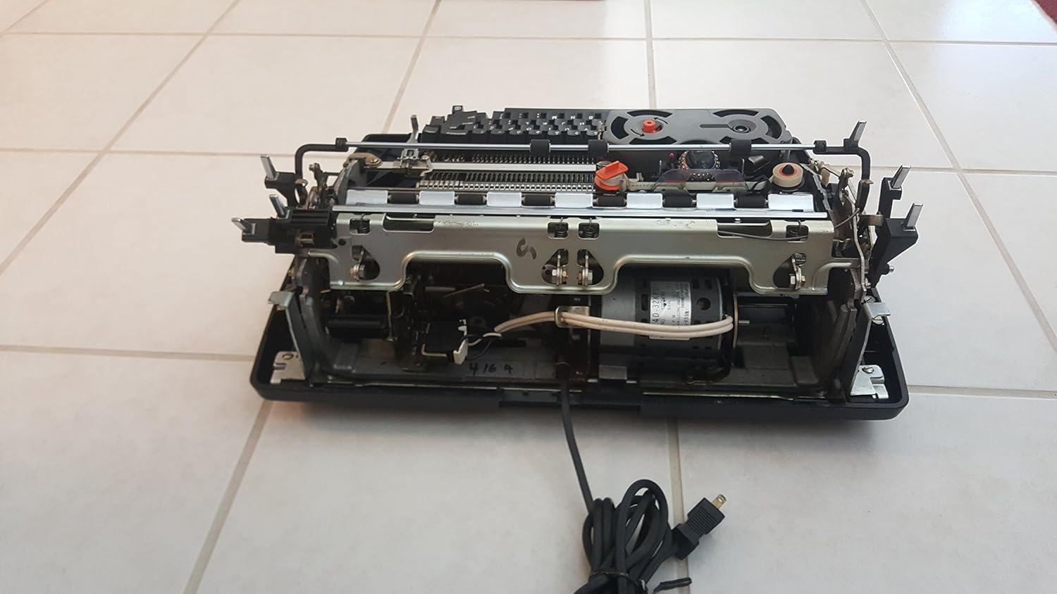 Underside view of the IBM Selectric III Typewriter showing the power cord
