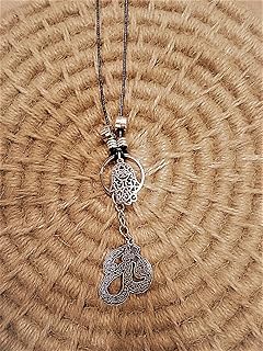 Car mirror hanger with a pendant in the shape of hands and a religious pendant