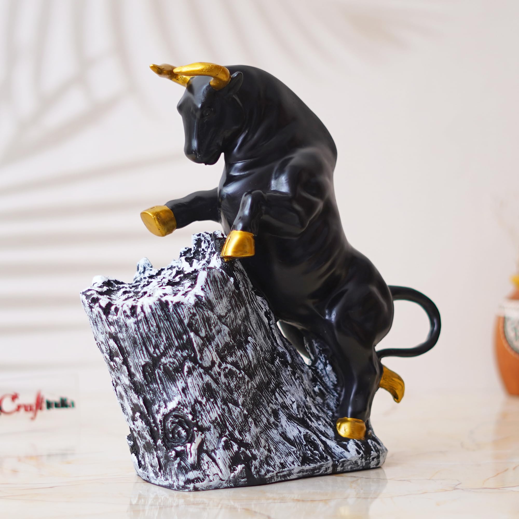 eCraftIndia Black Resin Bull Statue with Golden Horns & Climbing on Rock Showpiece for Home Decor Living Room Bedroom | Gift for Birthday Friendship Day
