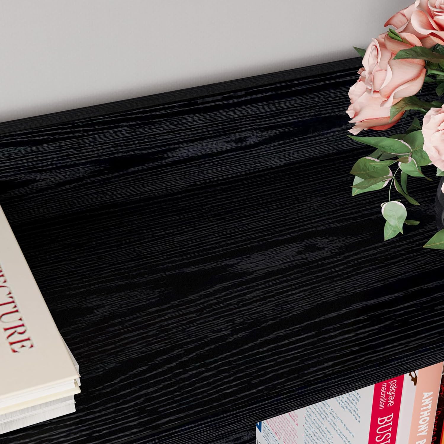 Close-up of a bookshelf shelf filled with books and a decorative bowl, highlighting the 2.8-inch baffle at the back.