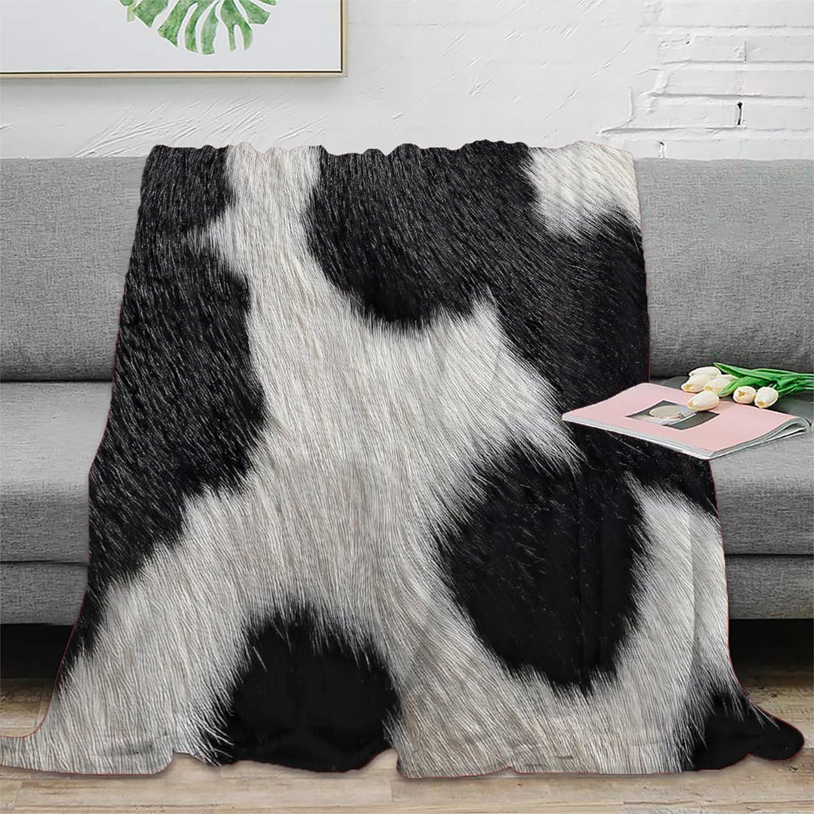 Couverture polaire anti-bouloche et antistatique motif peau de vache 180x200