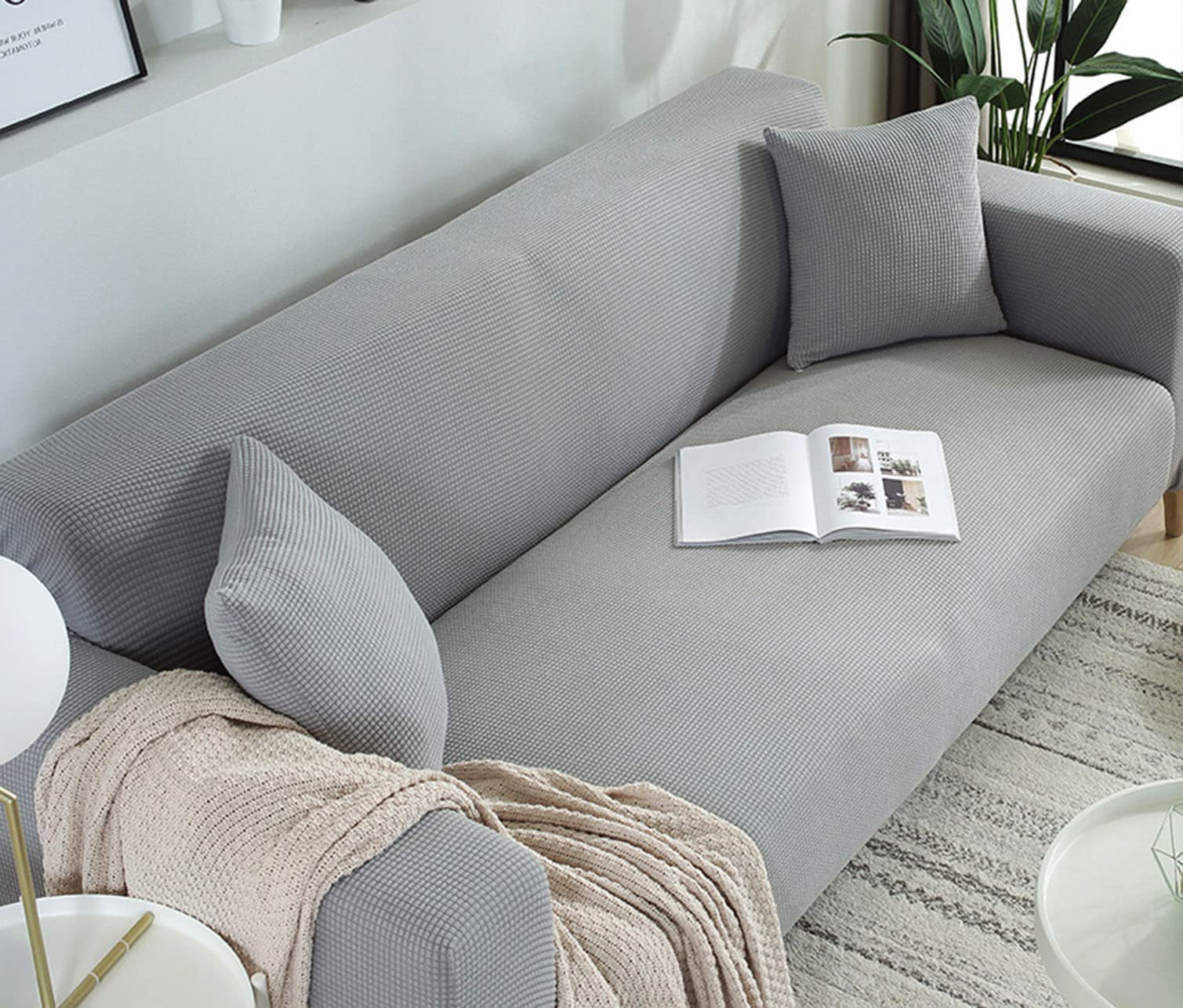 Housse de canapé extensible gris 3 places pour un salon protégé
