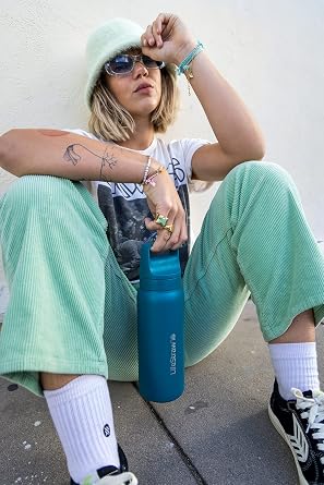 LifeStraw Go Series — Insulated Stainless Steel Water Filter Bottle for Travel and Everyday Use Removes Bacteria, Parasites and Microplastics, Improves Taste, 24oz Laguna Teal