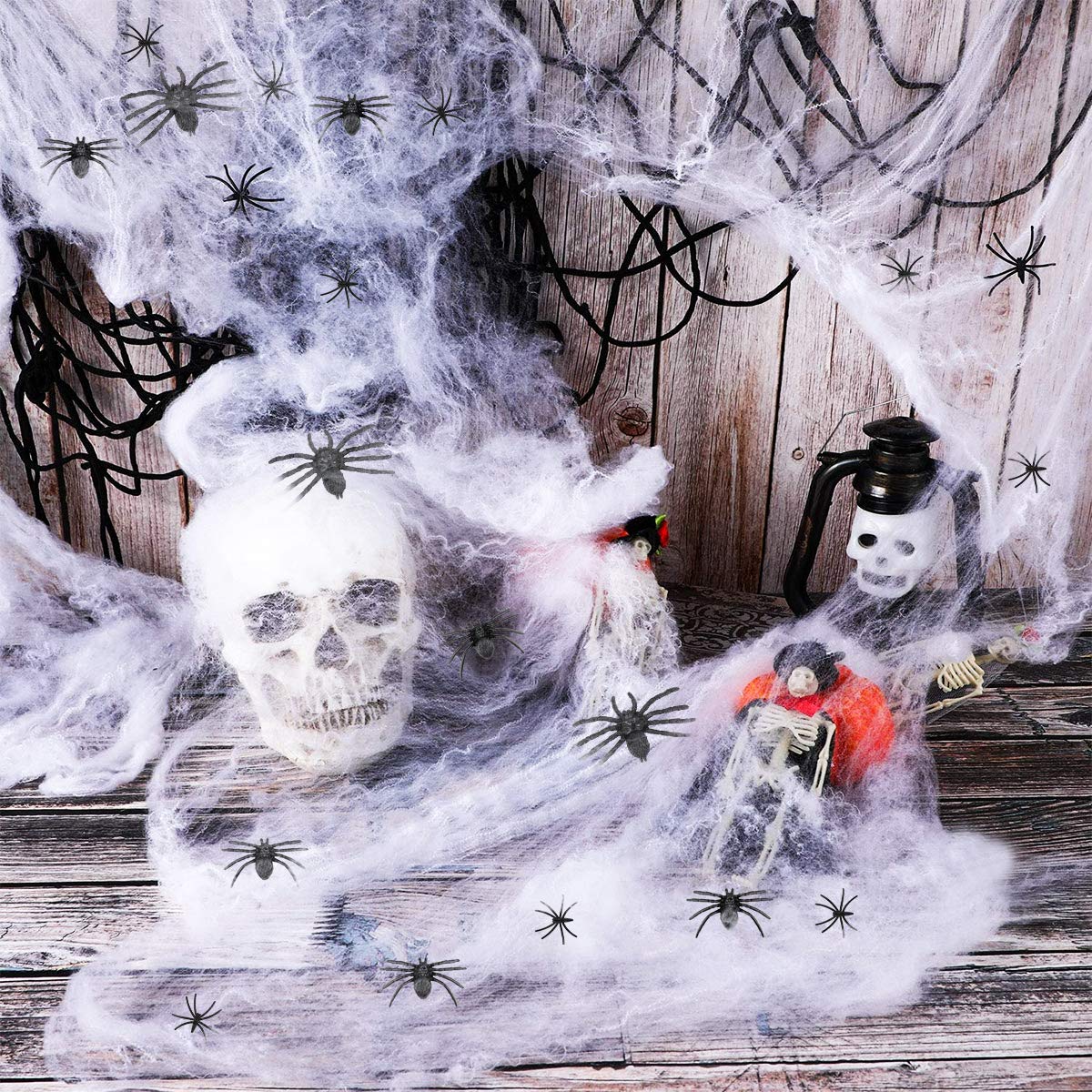 decorazioni di ragnatele di Halloween con ragni finti extra, ragnatele