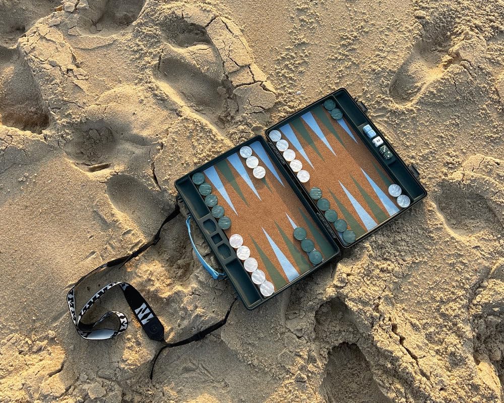 GAMMN Travel Backgammon Carry Case - Rugged Durable High Impact Khaki Green Modern Case With Cork Playing Field, Resin Checkers + Shoulder Strap, 34 x 26cm closed case, Adults 14+