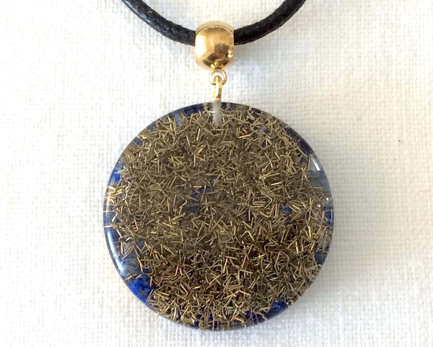 Orgone pendant necklace with golden Eye of Horus and Lapis Lazuli stones. Egyptian amulet 1.38 inch diameter. Made in USA