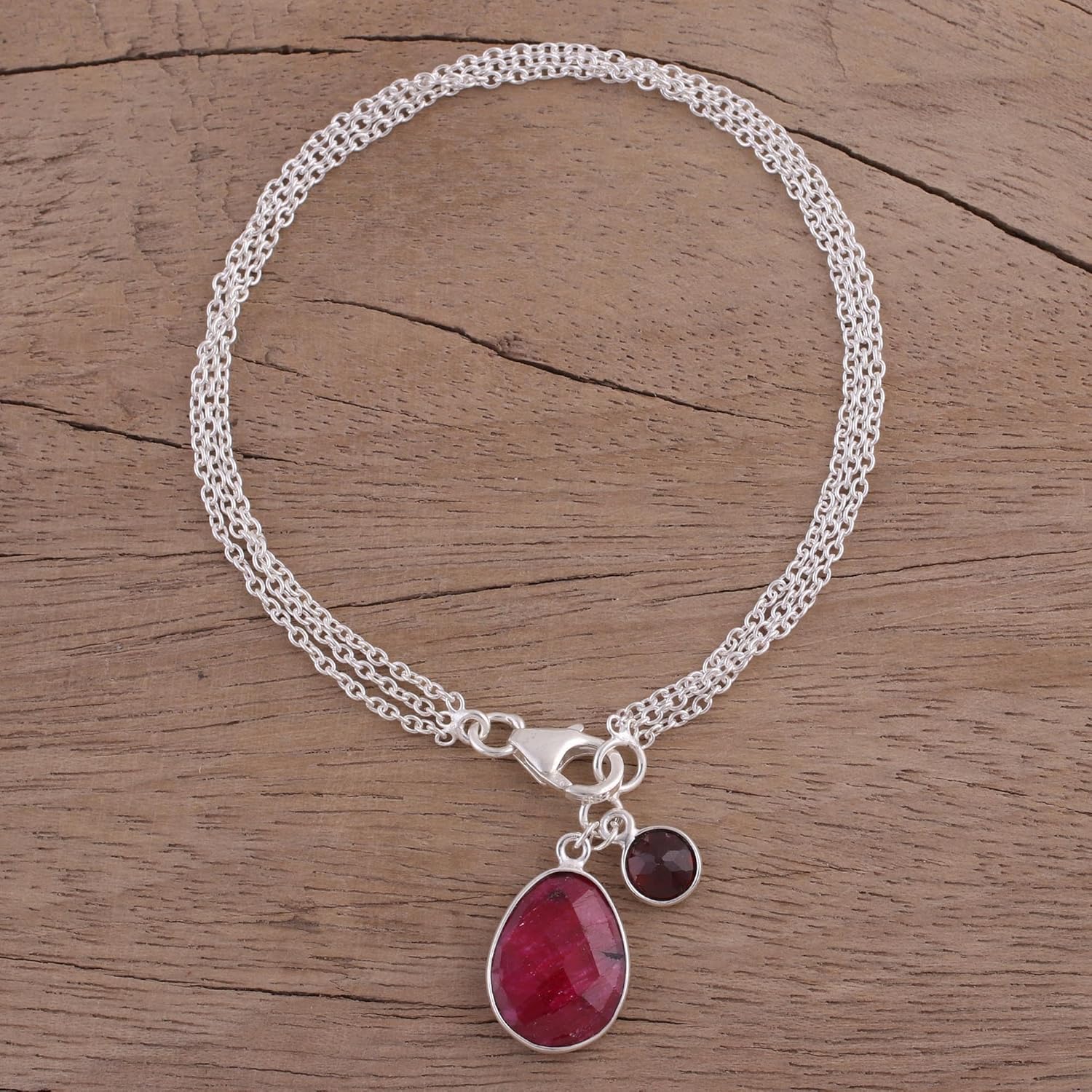 NOVICA Artisan Handmade Ruby Garnet Charm Bracelet Sterling Silver from India Birthstone [bracelet 7.5 in L x 0.2 in W Largest Piece 0.7 in H x 0.4 in W x 0.2 in D Smallest Piece 0.4 in H x 0.3 in W ]
