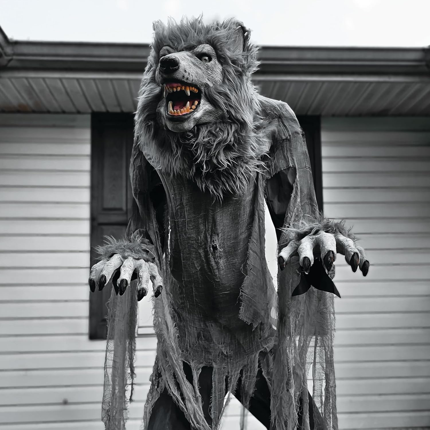 Close-up of the werewolf's head with glowing green eyes and open jaws, showing its detailed teeth and fur.