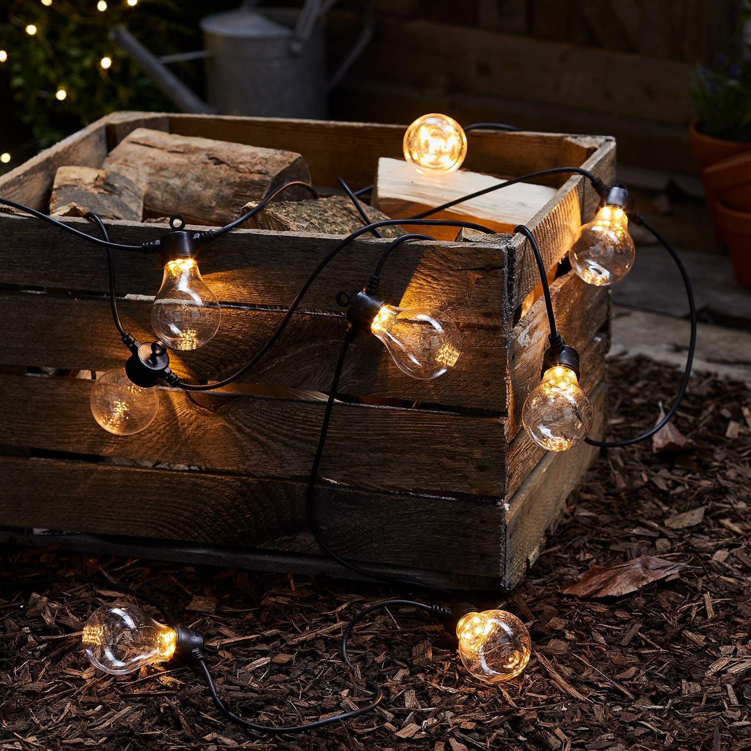 Lights4fun Glühbirnen-Lichterkette | Core Connect mit 20 warmweißen LEDs | klare transparent schwarz | inkl. Netzstecker für Innen & Außen | Garten Party | Länge 10 m