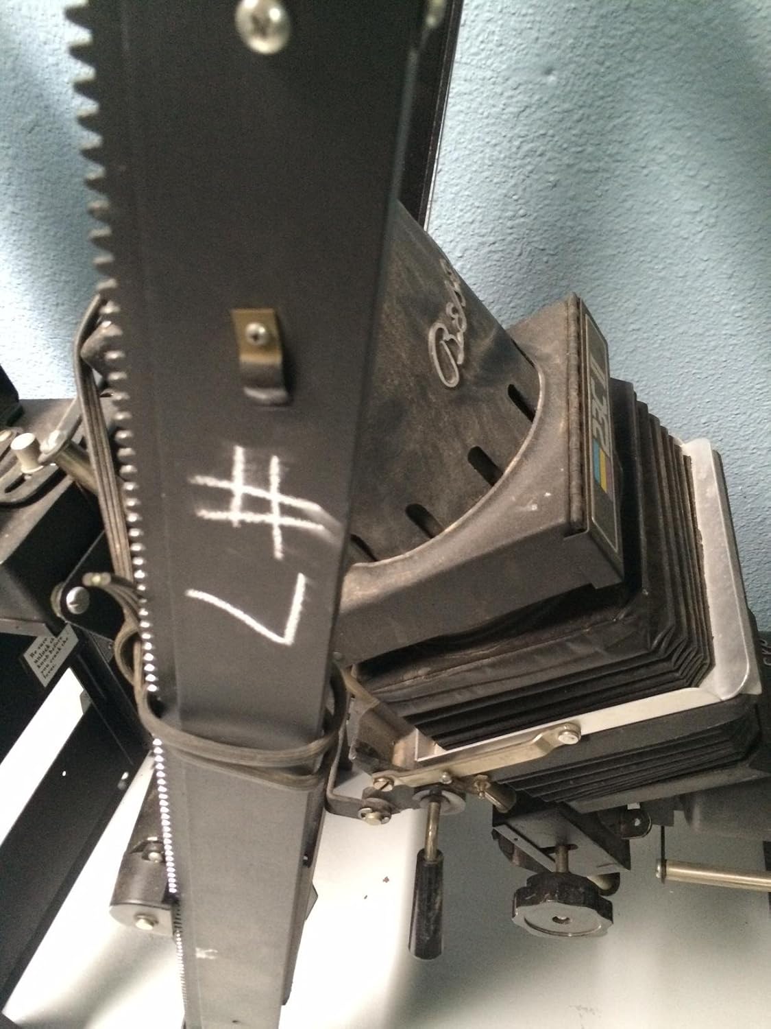 Close-up view of the Beseler 23c II enlarger head, showing the bellows and focusing mechanism.