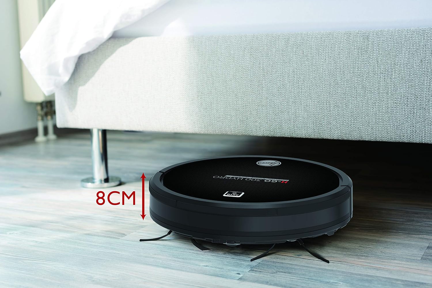 Hoover H-GO 300 Hydro robot vacuum under furniture, showing its 8cm height