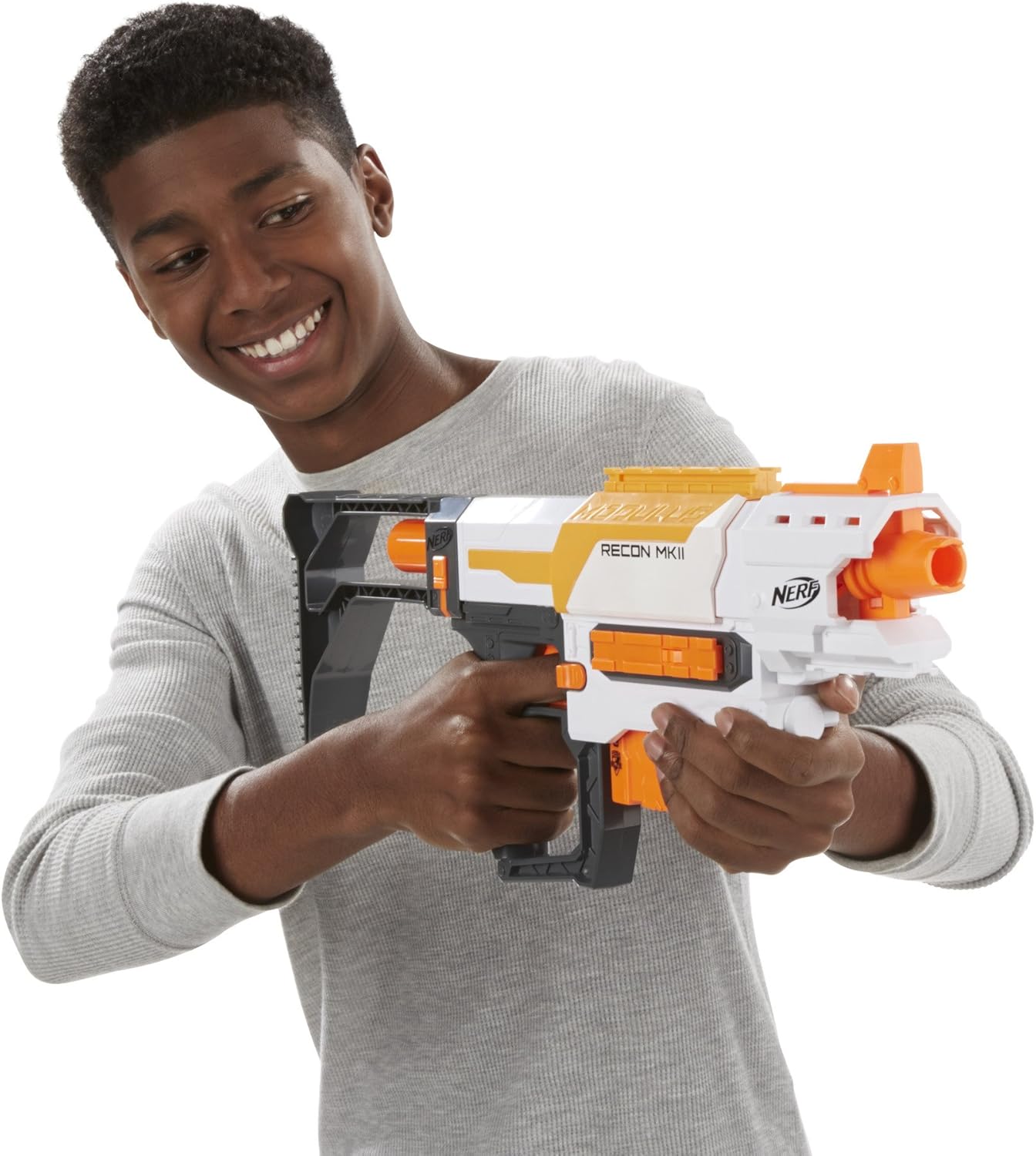 A person holding the assembled Nerf Modulus Recon MK II Blaster, aiming forward as if firing.