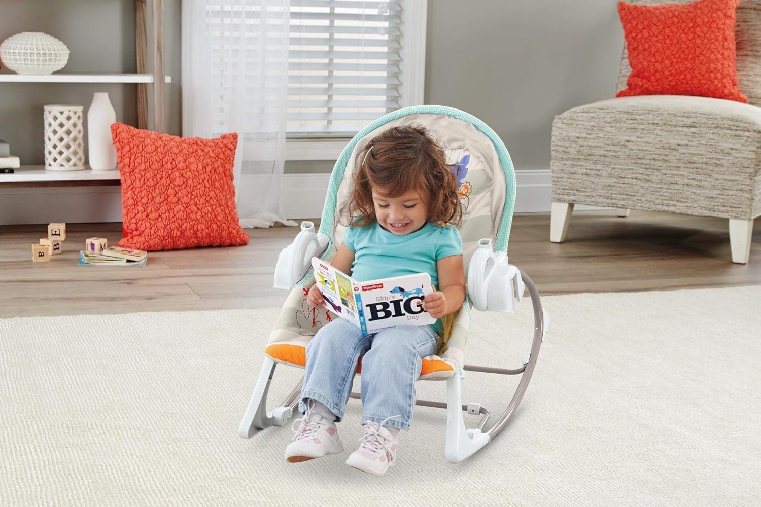Toddler sitting in the Fisher-Price 3-in-1 Bouncer & Rocker in toddler rocker mode, reading a book