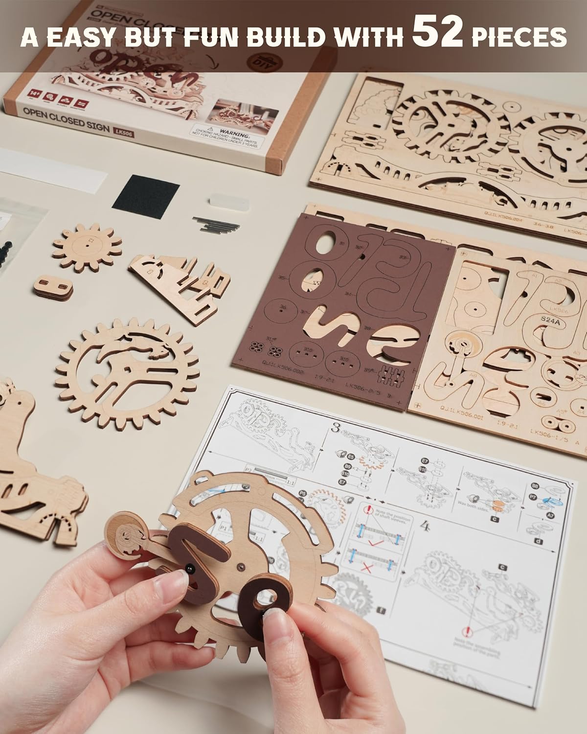 Contents of the ROBOTIME LK506 puzzle kit, including laser-cut wooden sheets and instruction manual