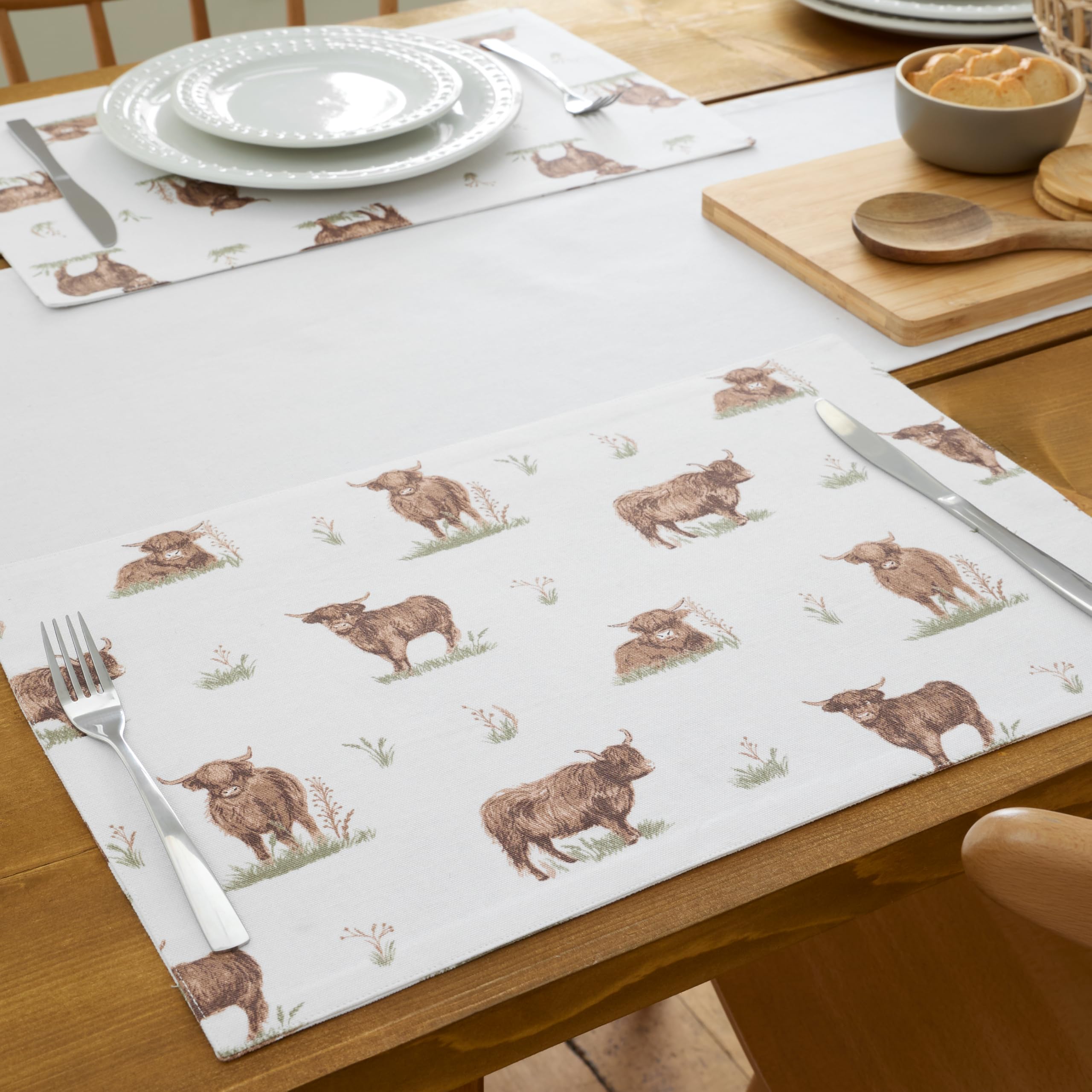 Catherine Lansfield Angus Highland Cow Cotton 30X46Cm Dining Placemat 4 Pack Natural from B&Q