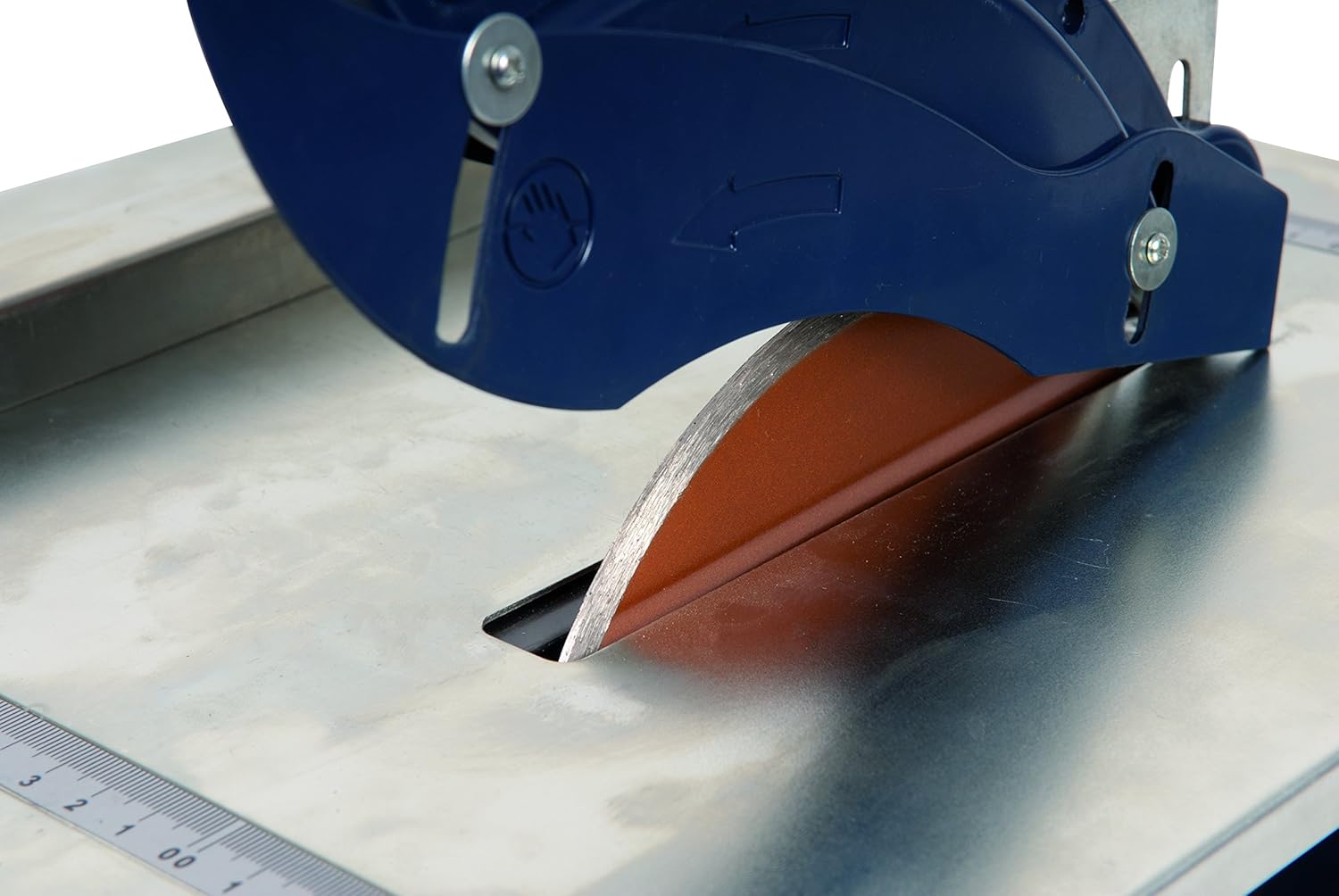 Close-up view of the diamond blade partially submerged in water, ready for cutting.