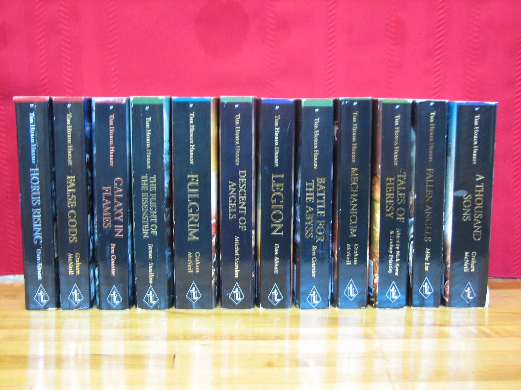 Horus Heresy Series Set (Warhammer 40K), Volumes 1-12 (Titles (in order) include: Horus Rising, False Gods, Galaxy in Flames, The Flight of the Eisenstein, Fulgrim, Descent of Angels, Legion, Battle for the Abyss, Mechanicum, Tales of Heresy, Fallen Angels, A Thousands Sons) Mass Market Paperback