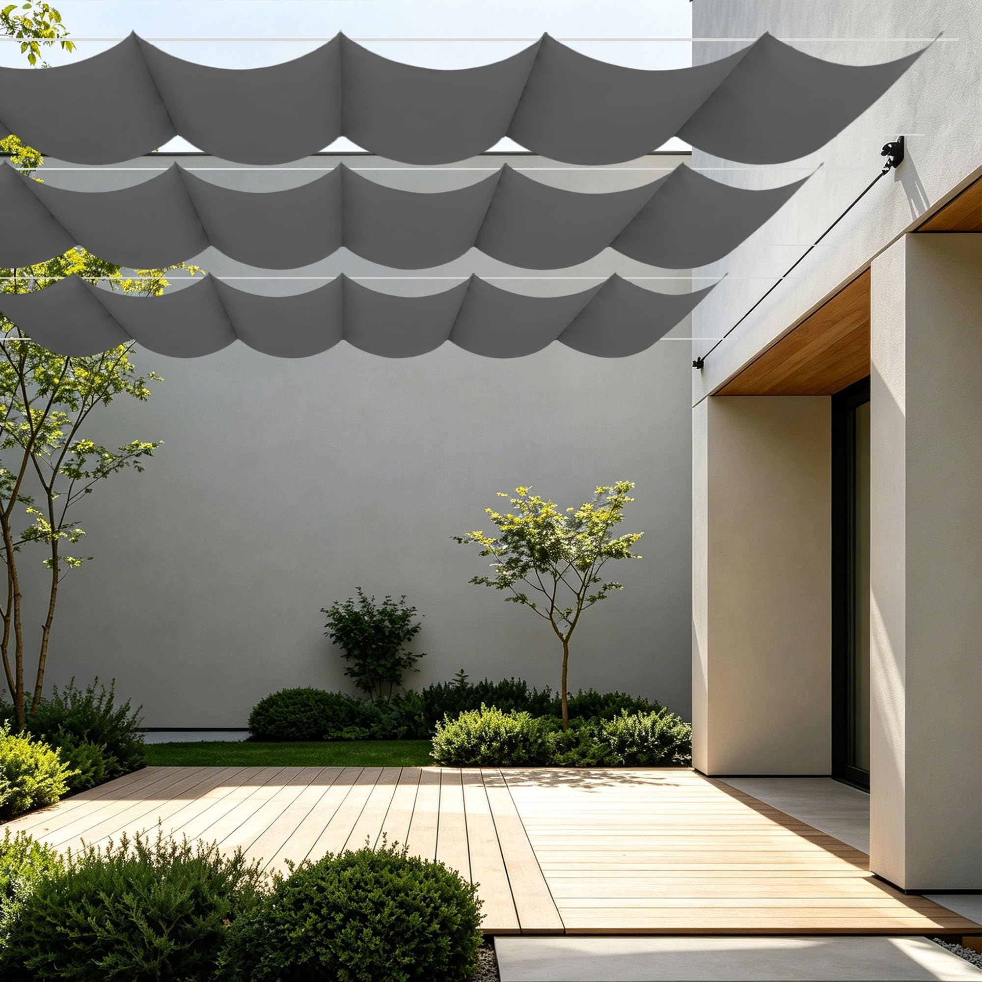 Vela de sombra impermeable gris oscuro contra el calor del jardín
