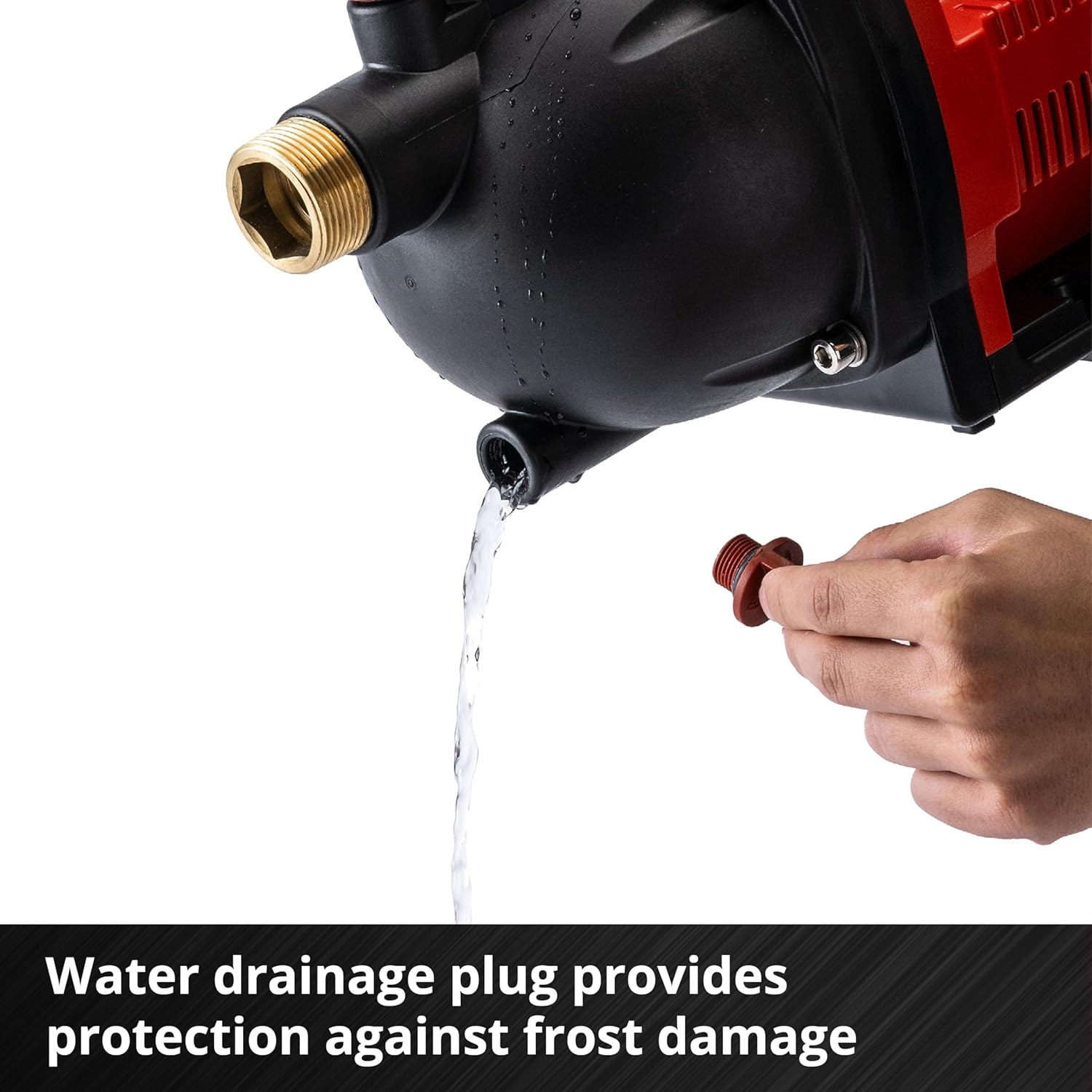 Hand unscrewing the water drainage plug from the pump