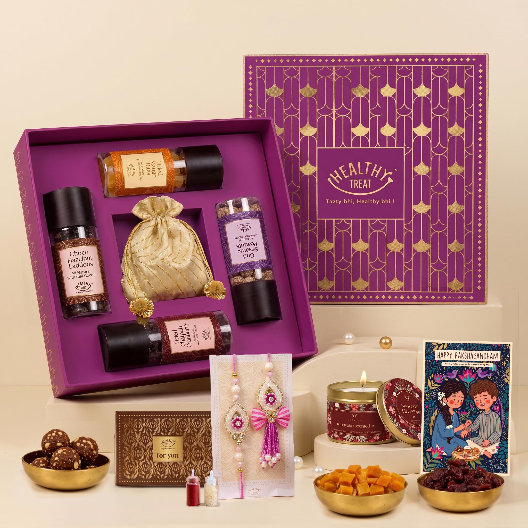 Healthy Treat Utsav Bhaiya Bhabhi Rakhi Set with Lumba & Candle, 10 Items | Lumba Rakhi Pair, Roli Chawal, Scented Candle, Dried Mango, Sesame Peanut, Chocolate Laddoo, Cranberry, Raksha Bandhan-image-28