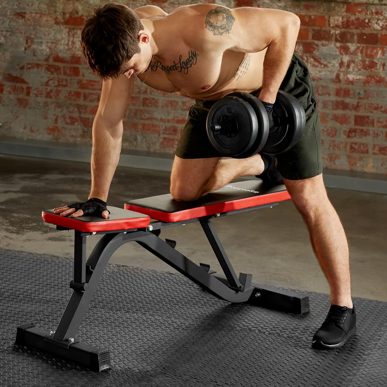 Man performing a dumbbell row exercise on the tectake adjustable dumbbell bench