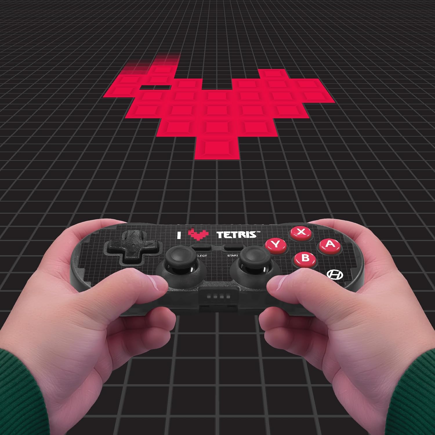 Person holding the Hyperkin Pixel Art Bluetooth Controller while playing a game