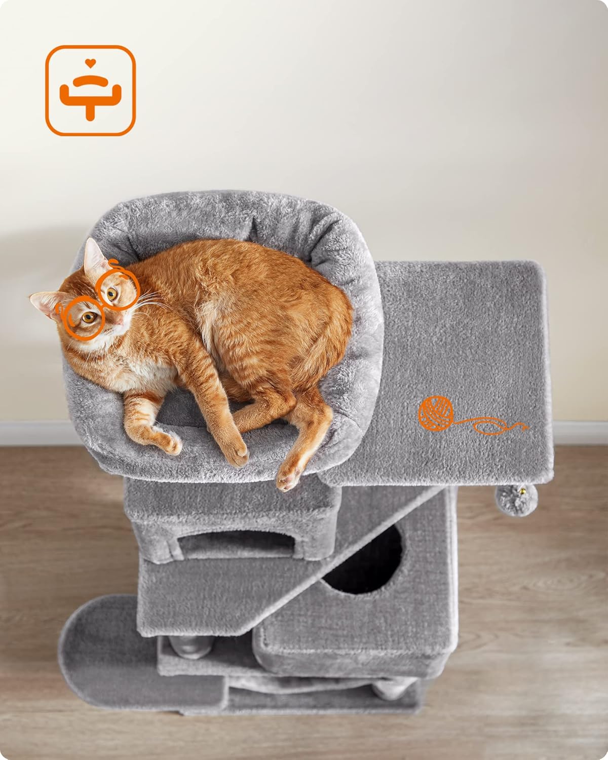 Overhead view of a cat resting on the top platform of the Feandrea Cat Tree