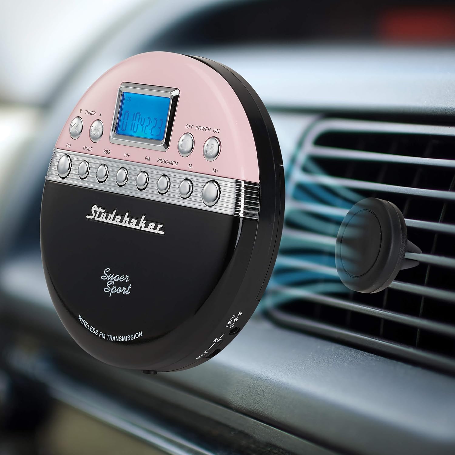 Studebaker SB3705PB Portable CD Player mounted on a car air vent using its magnetic holder.