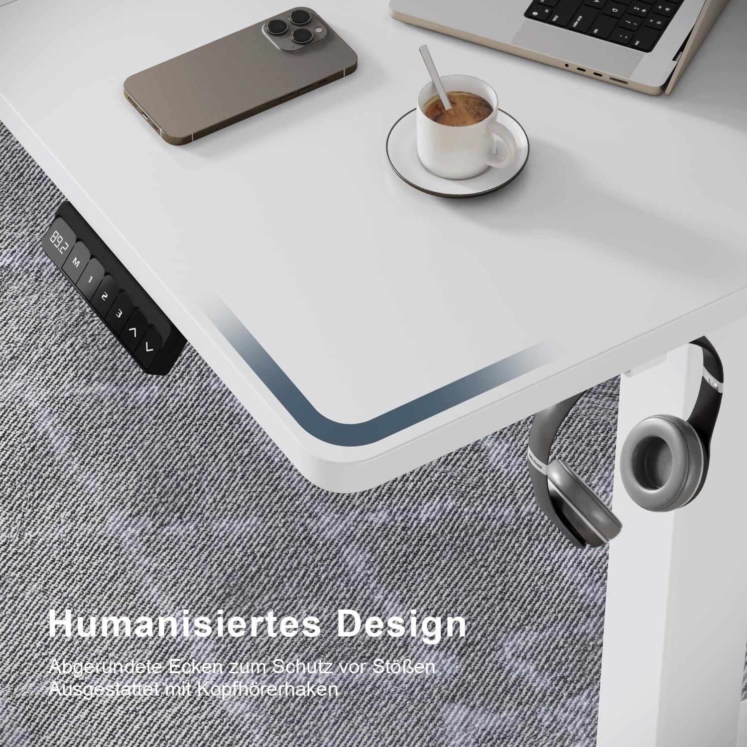 Close-up of desk corner showing rounded edges and headphone hook