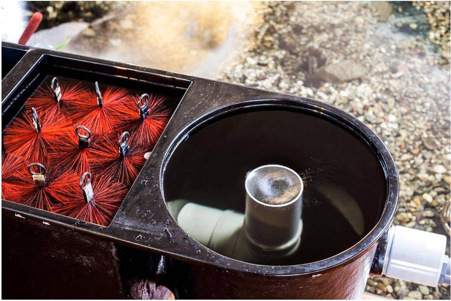 Close-up view of the filter brushes and the water inlet section of the Heissner Apollo XXL PRO pond filter.