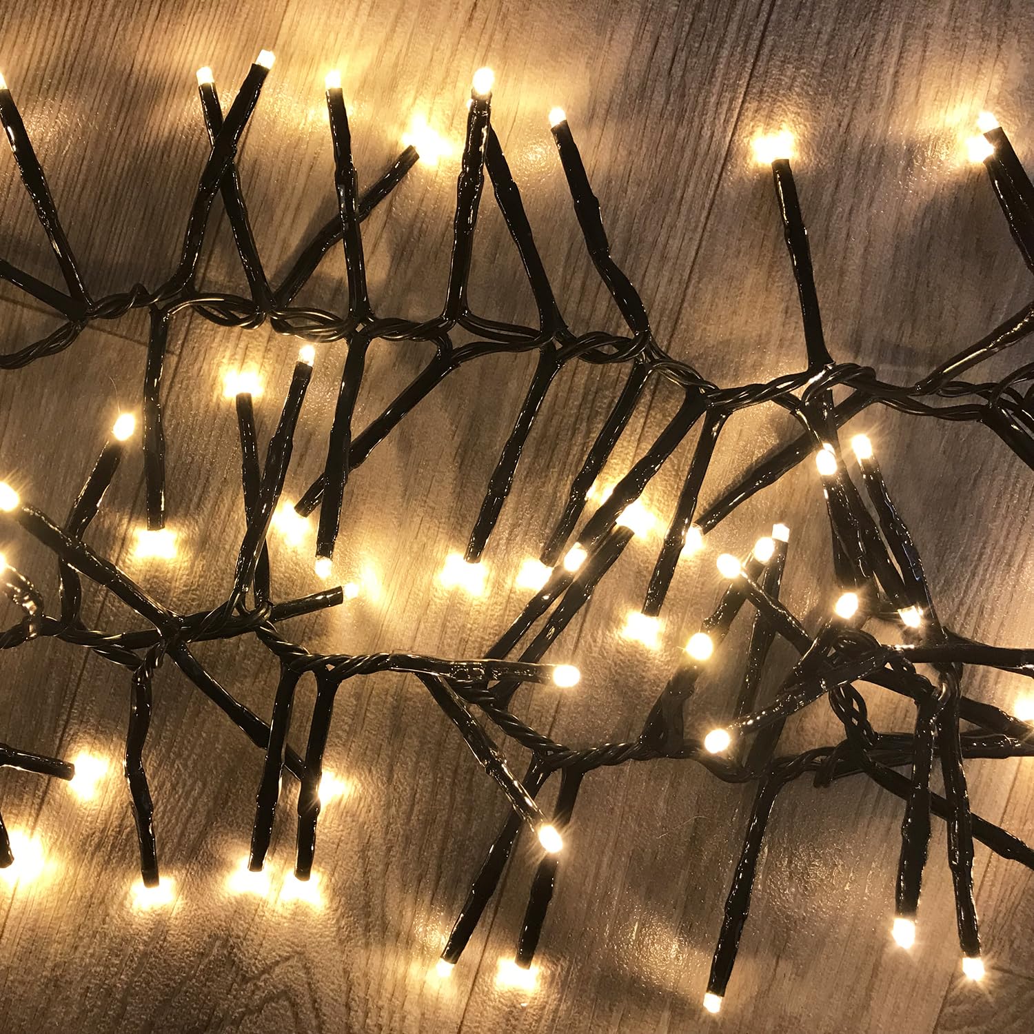 1200er Cluster-Lichterkette Weihnachtsbeleuchtung LEDs Innen und Außen Trafo warmweiß Kabel Dunkelgrün