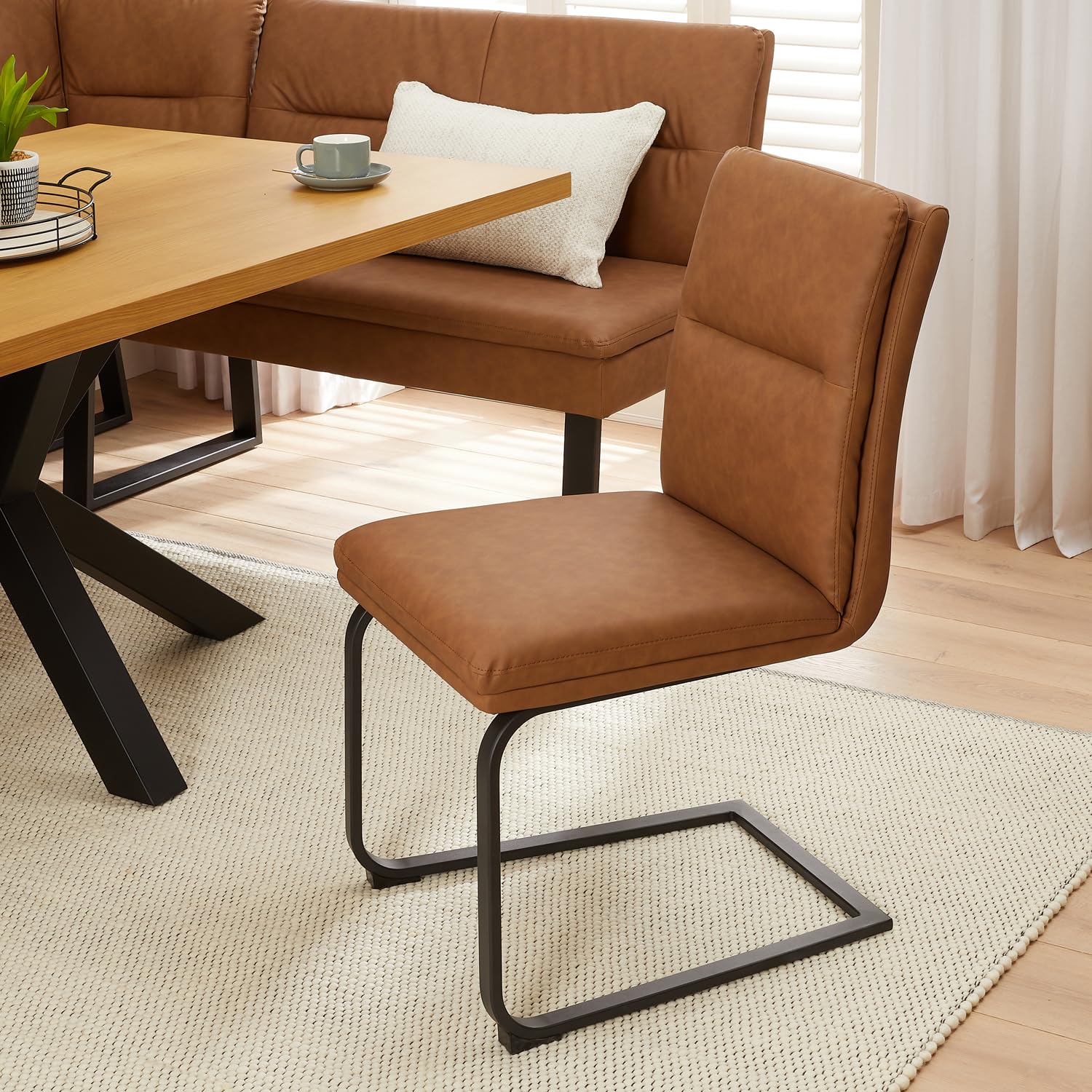 The Furniture Market Bronx Tan Brown Faux Leather Dining Chair | Cantilever Leg Design | Industrial Style | Vegan Friendly | Black Legs | H 900mm x W 470mm x D 610mm (Seat H 495mm)