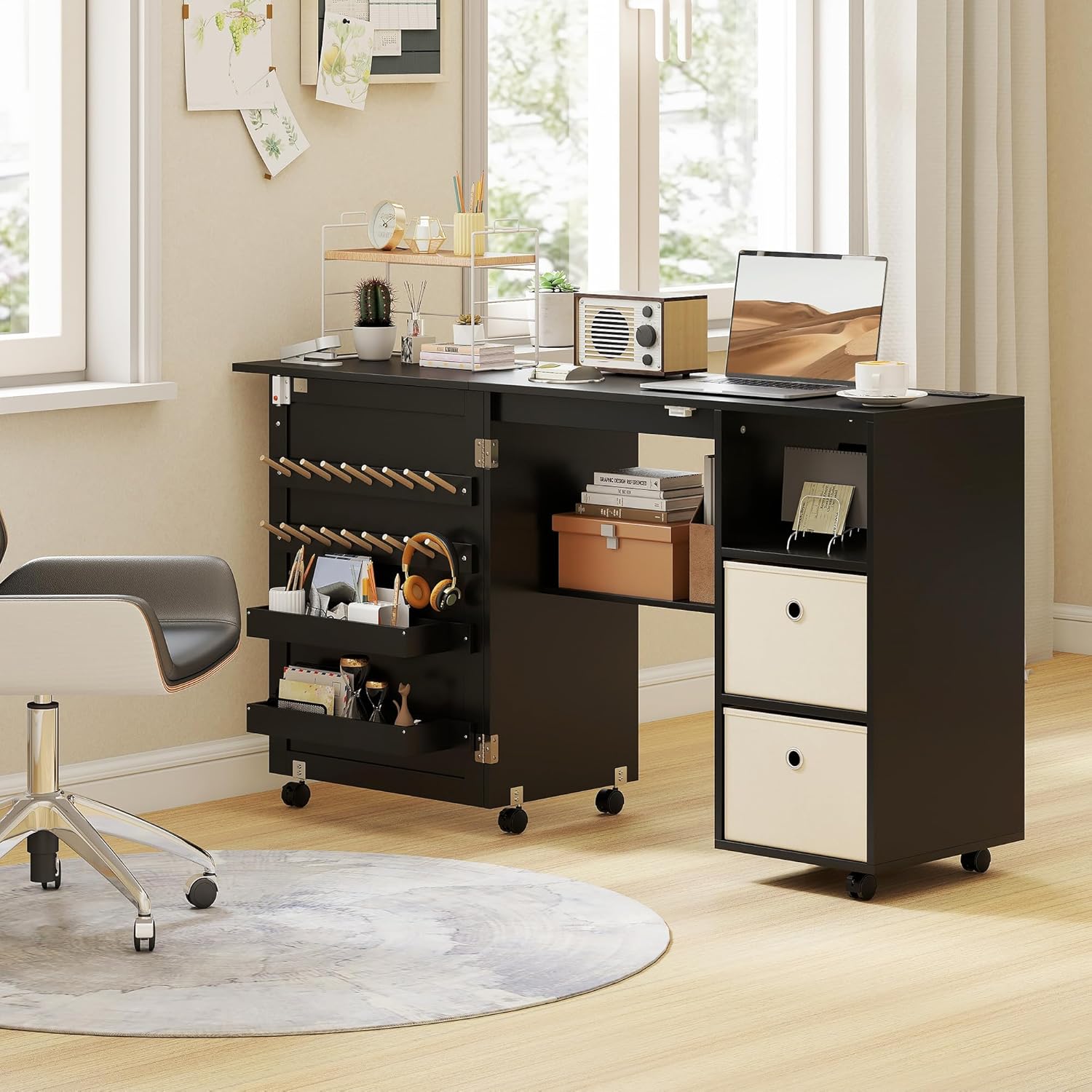 Close-up of a lockable caster wheel on the HOMCOM sewing table, showing the 360-degree rotation and lock icon.