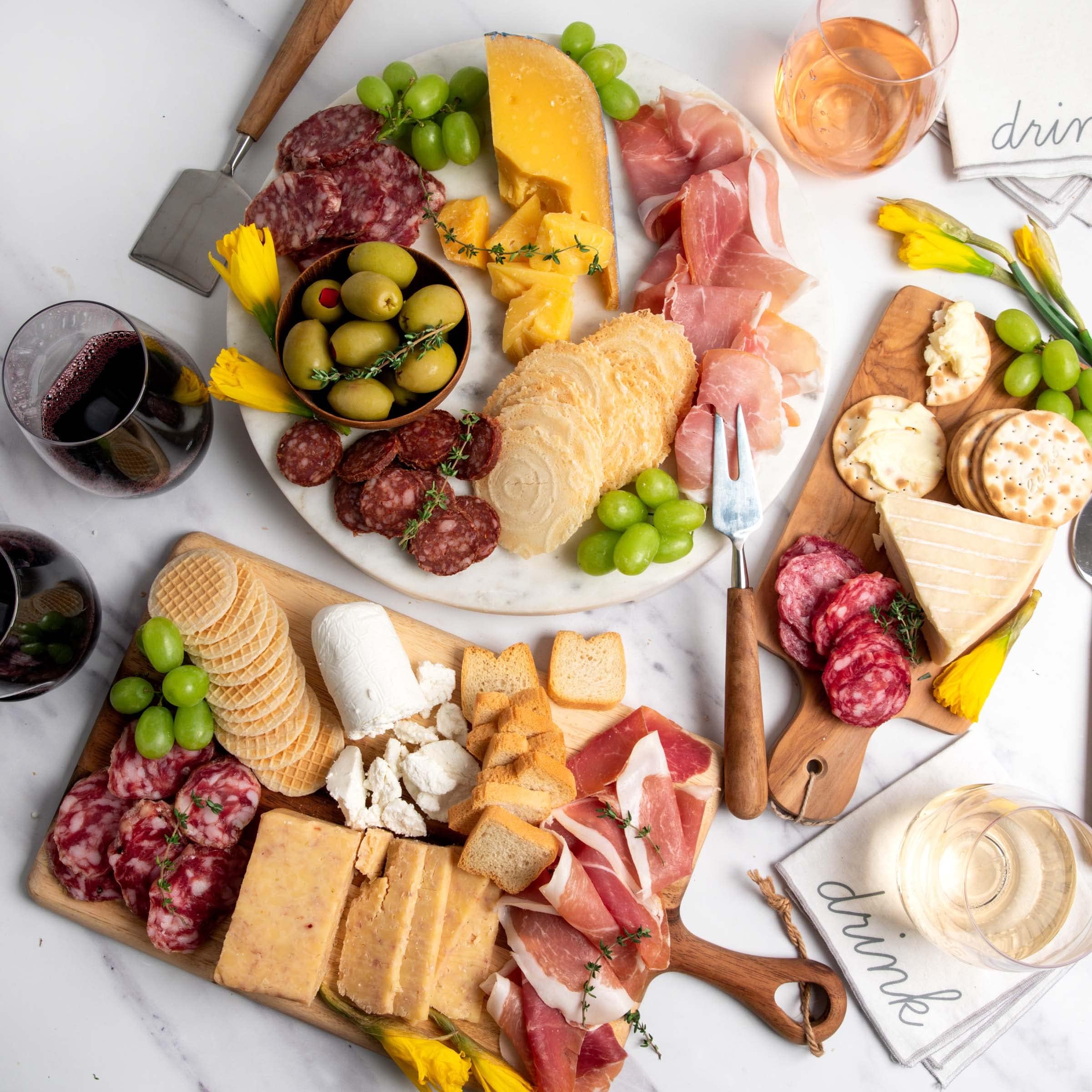 Grand Assortment of Meat and Cheese Favorites - Gouda, Cheddar, Chevre, and Fromager Cheeses, Ham, Prosciutto, and 4 Types Of Incredible Salami, 4 Types Of Crackers, and Stuffed Greek Olives