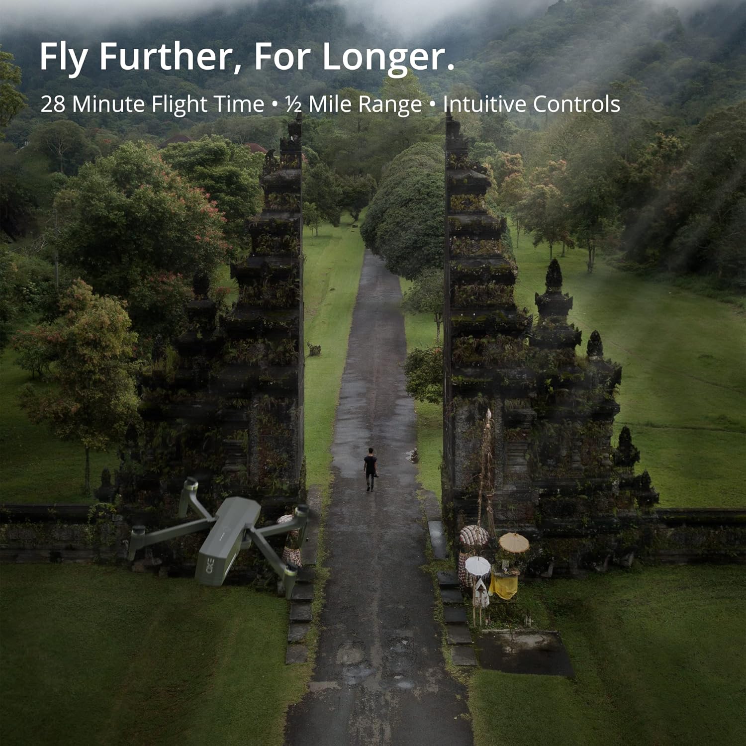 EXO Cinemaster 2 drone flying over a lush green valley with mountains in the background.