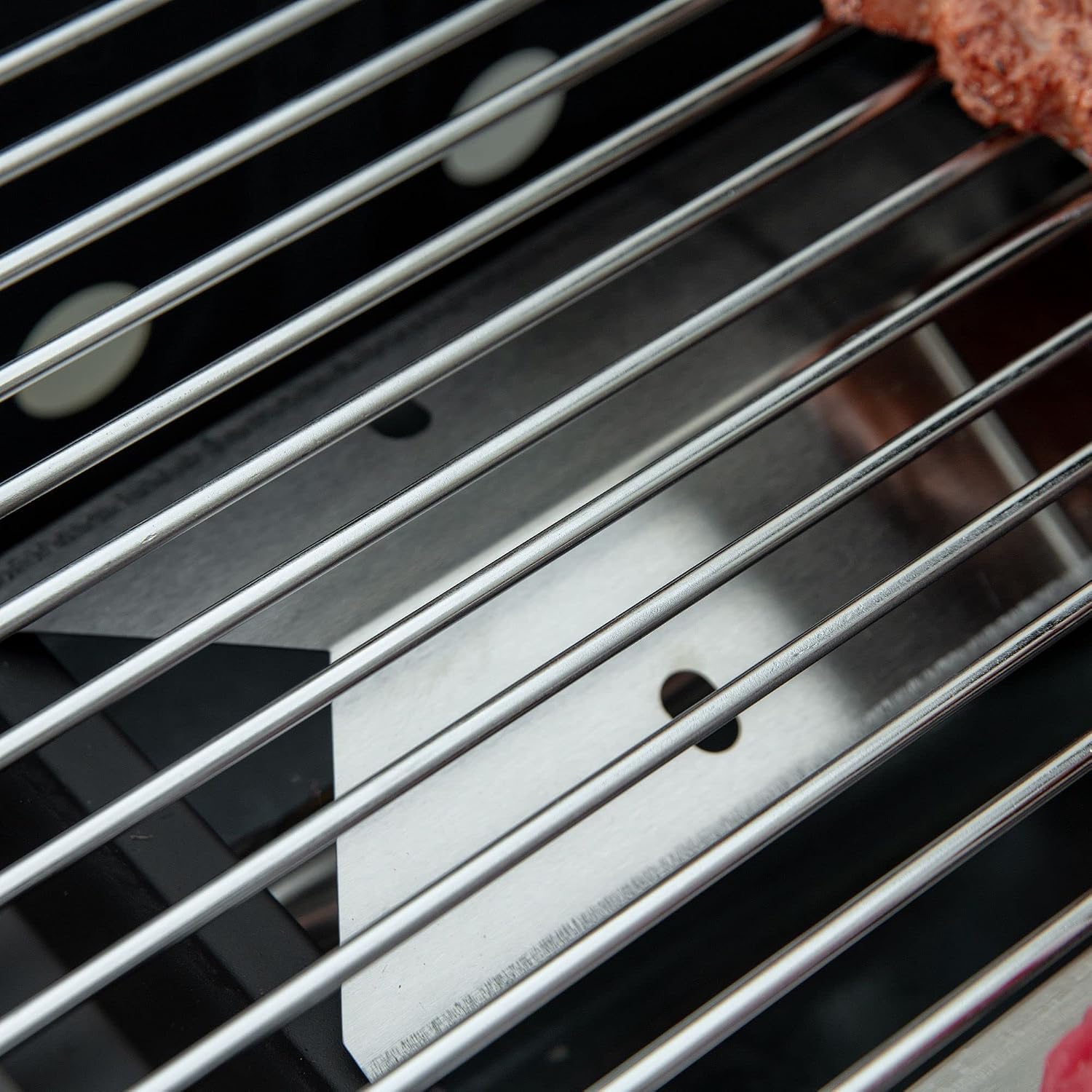 Close-up view of the clean metal grill grates.