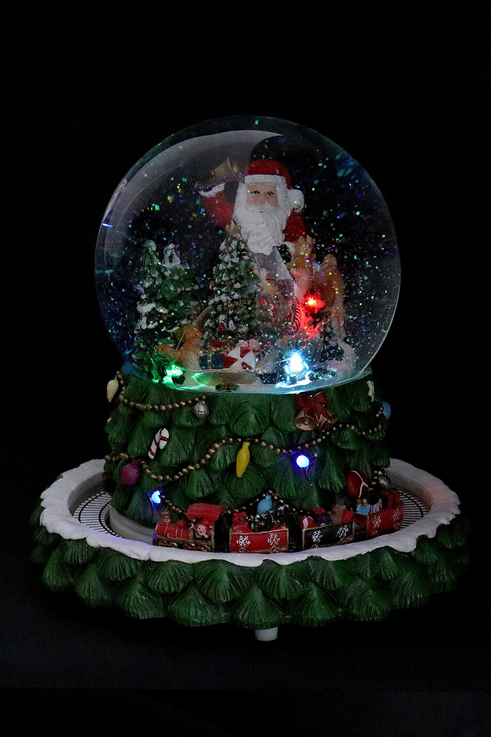 ELLUG Schneekugel/Spieluhr Tannenbaum ⌀150mm, weihnachtlicher Sockel mit rotierendem Zug, Musik, Licht & Schneeantrieb, H: 23,5cm