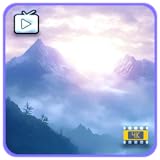 霧の山々の夜明け – 穏やかな日の出の光に包まれた静かな霧の峰々と、安らぎの雰囲気を醸し出すスリープタイマー付きFire TVスクリーンセーバー